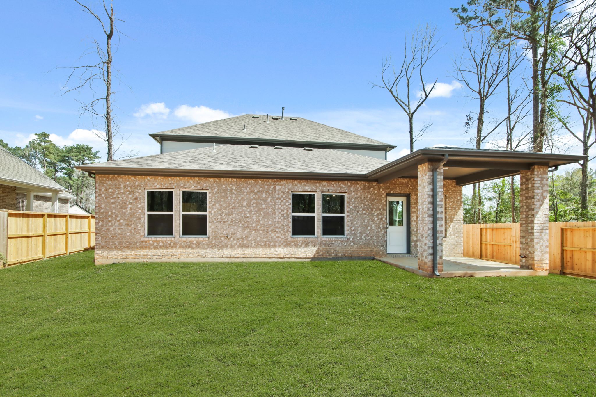 A house with a grass yard.