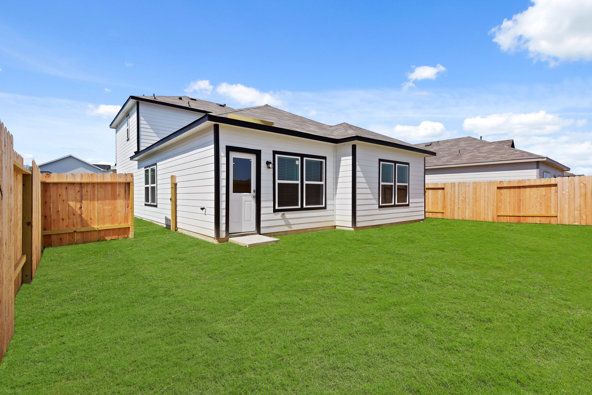 A house with a grass yard.