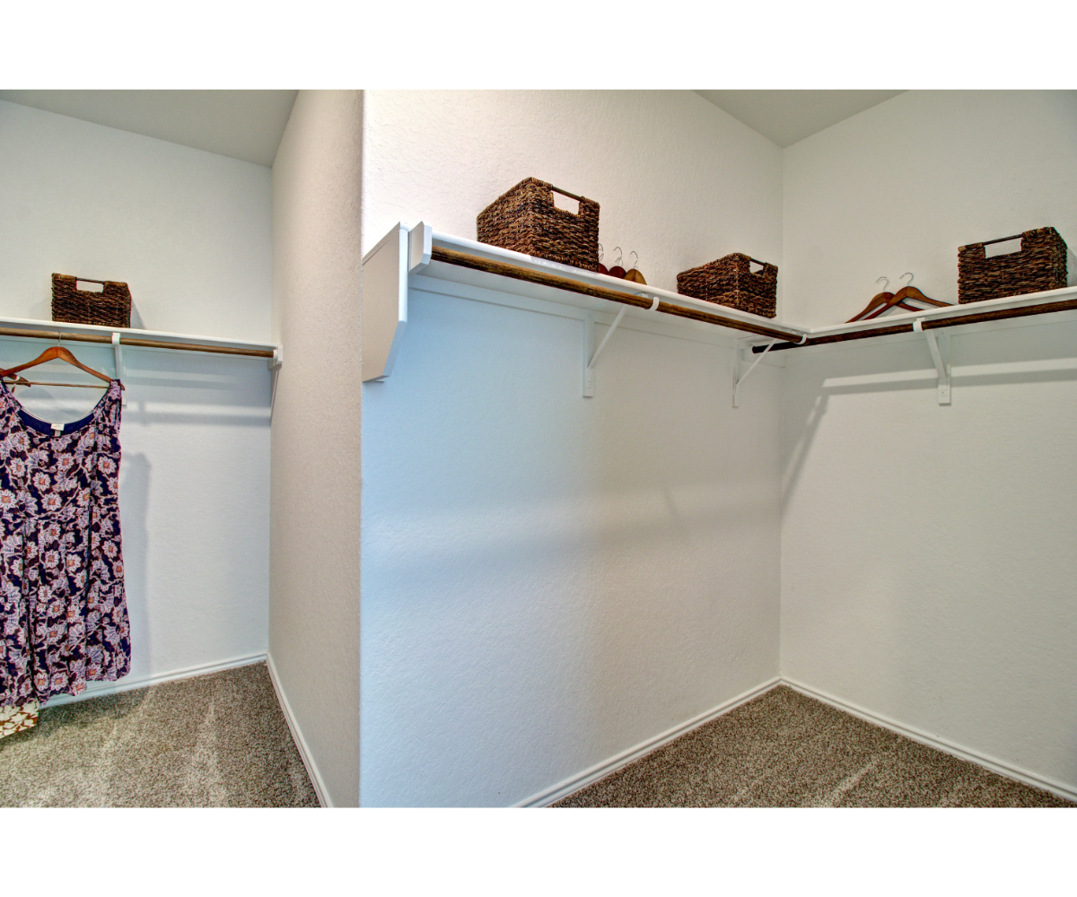 A room with shelves and a basket.