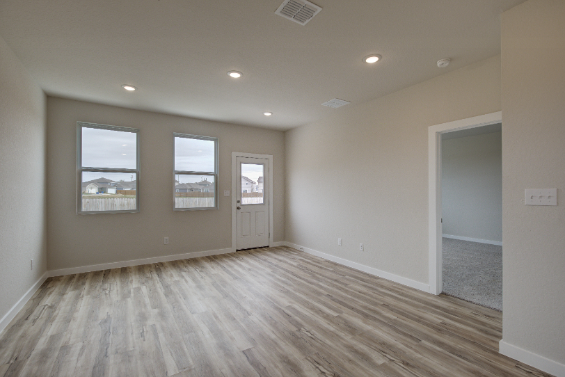 A room with a wood floor and a wood floor.