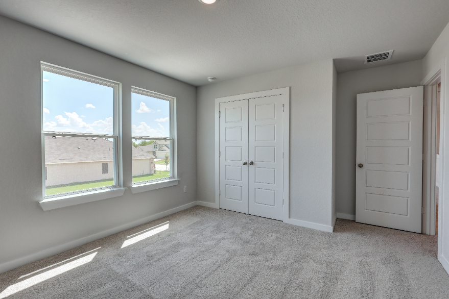 A room with white doors and windows.