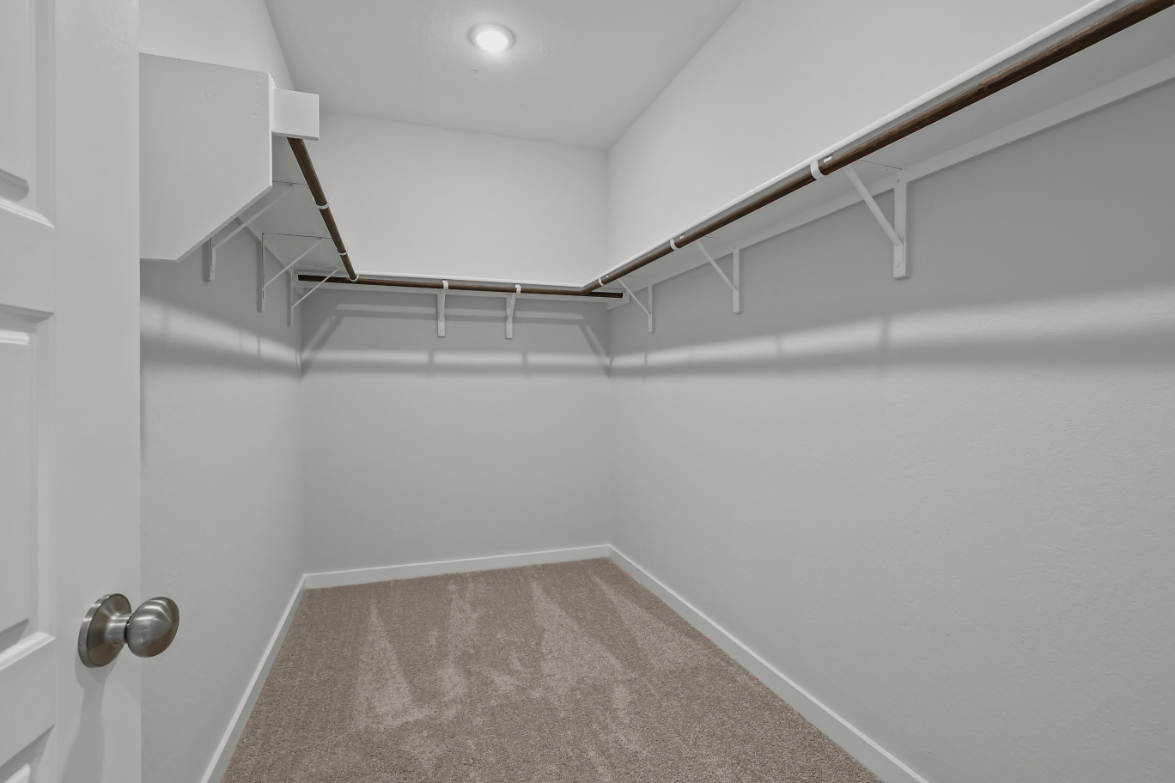 A white room with a staircase.