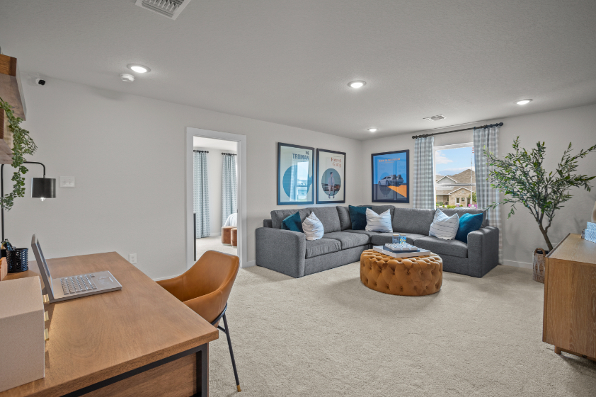 A living room with a couch and a table.