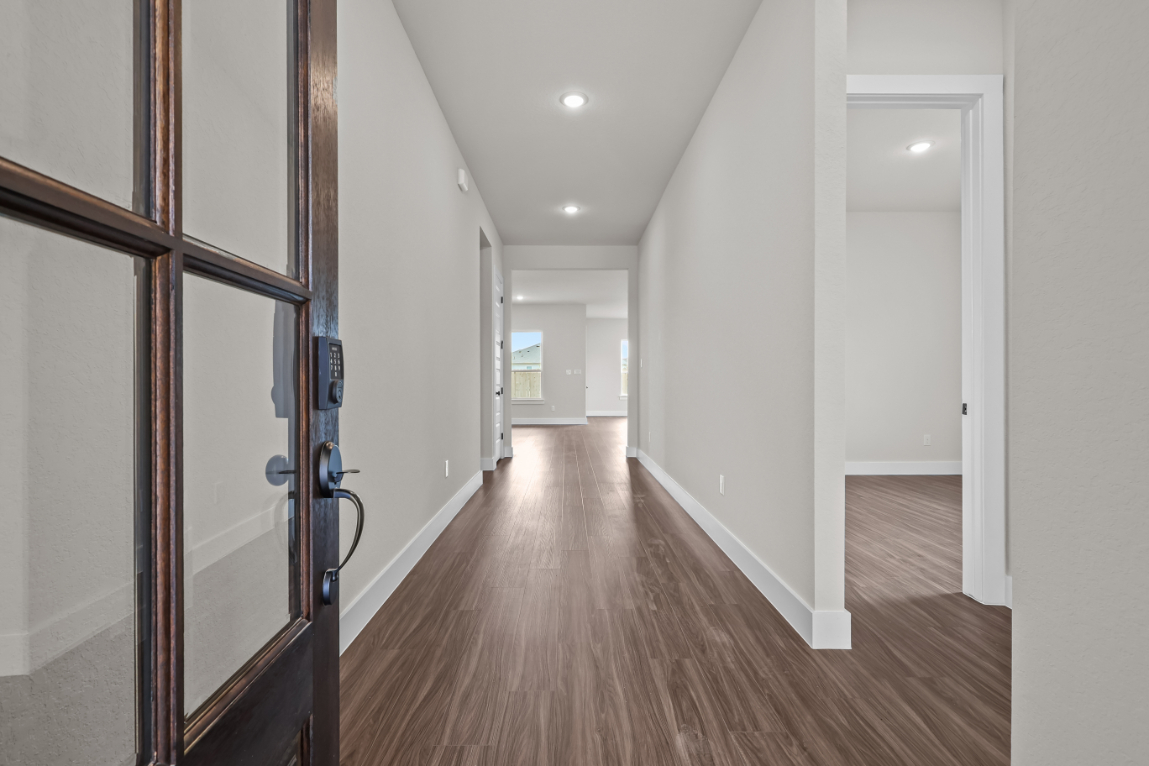 A hallway with glass doors.