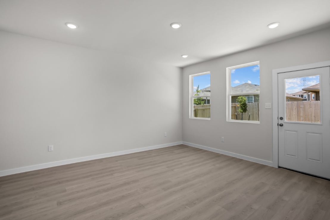 A room with white walls and windows.
