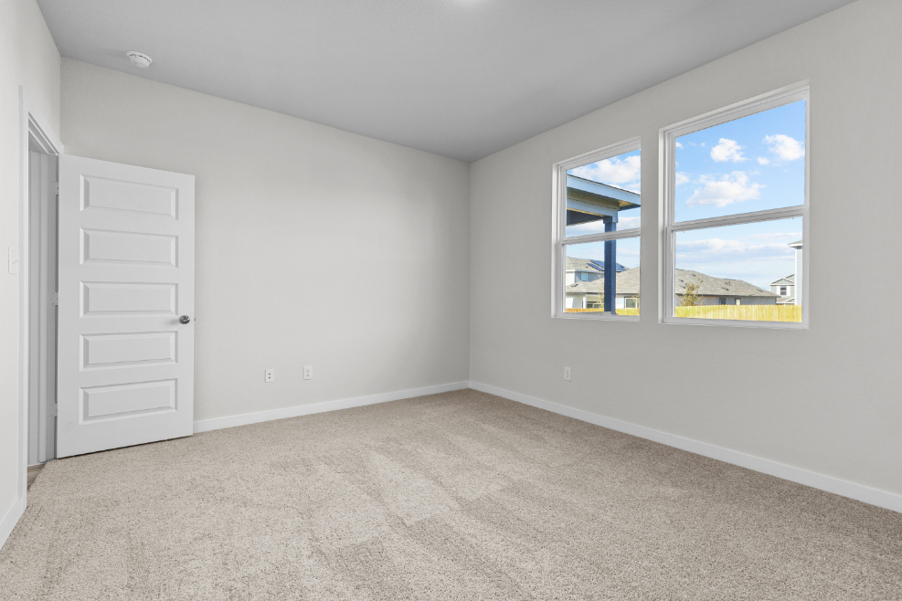 A room with a window and a door.