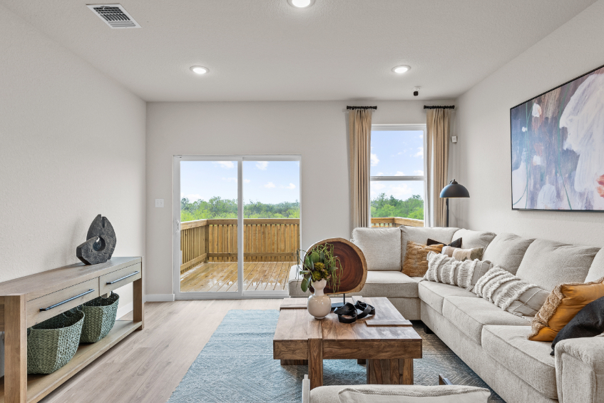 A living room with a large glass door.