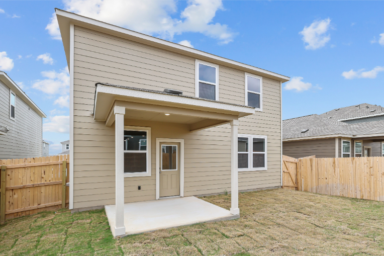 A small house with a fence.