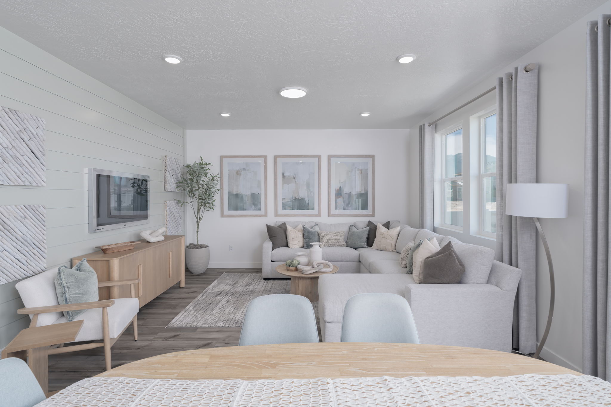 A living room with a couch and a table.