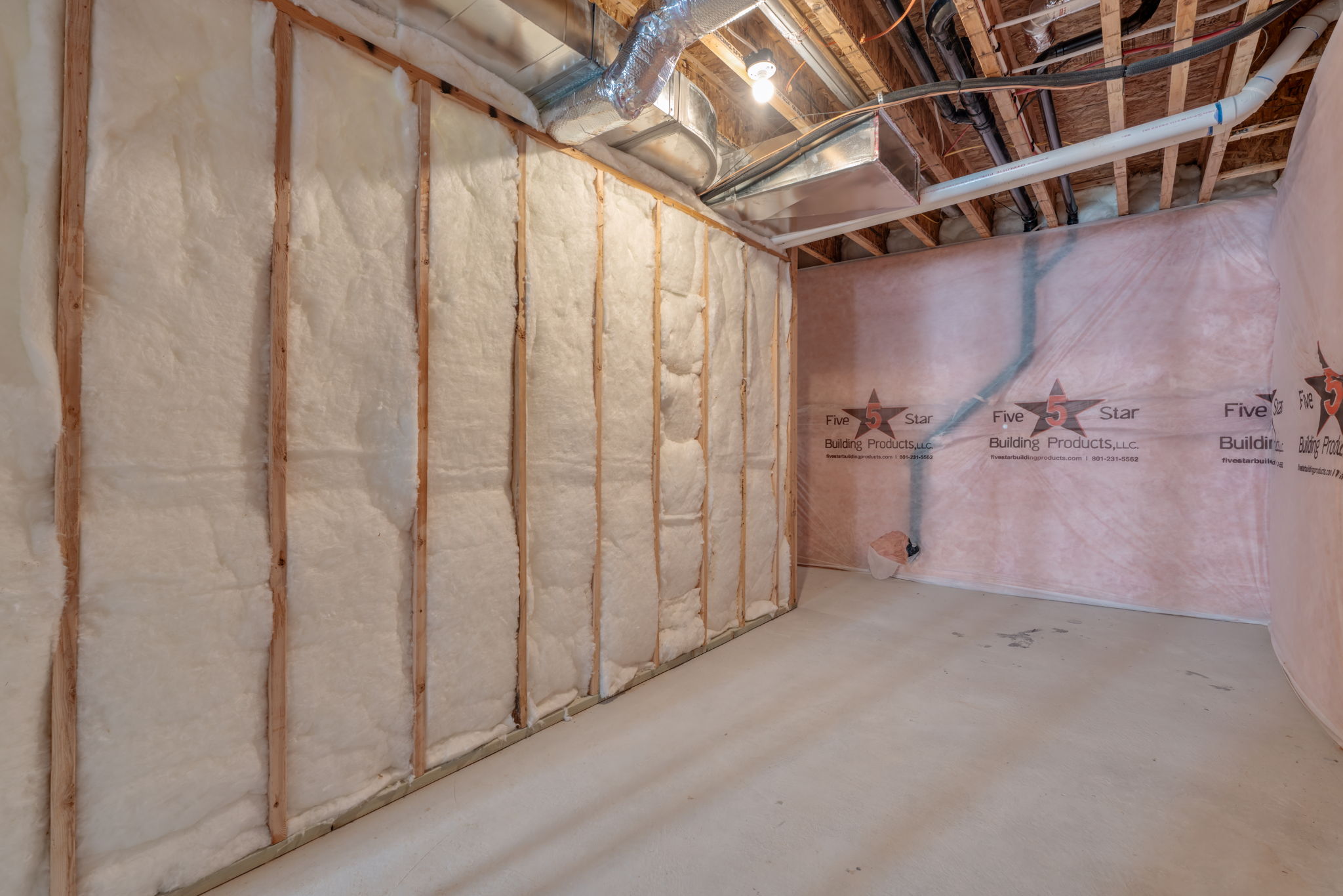 A room with a wall of barrels.