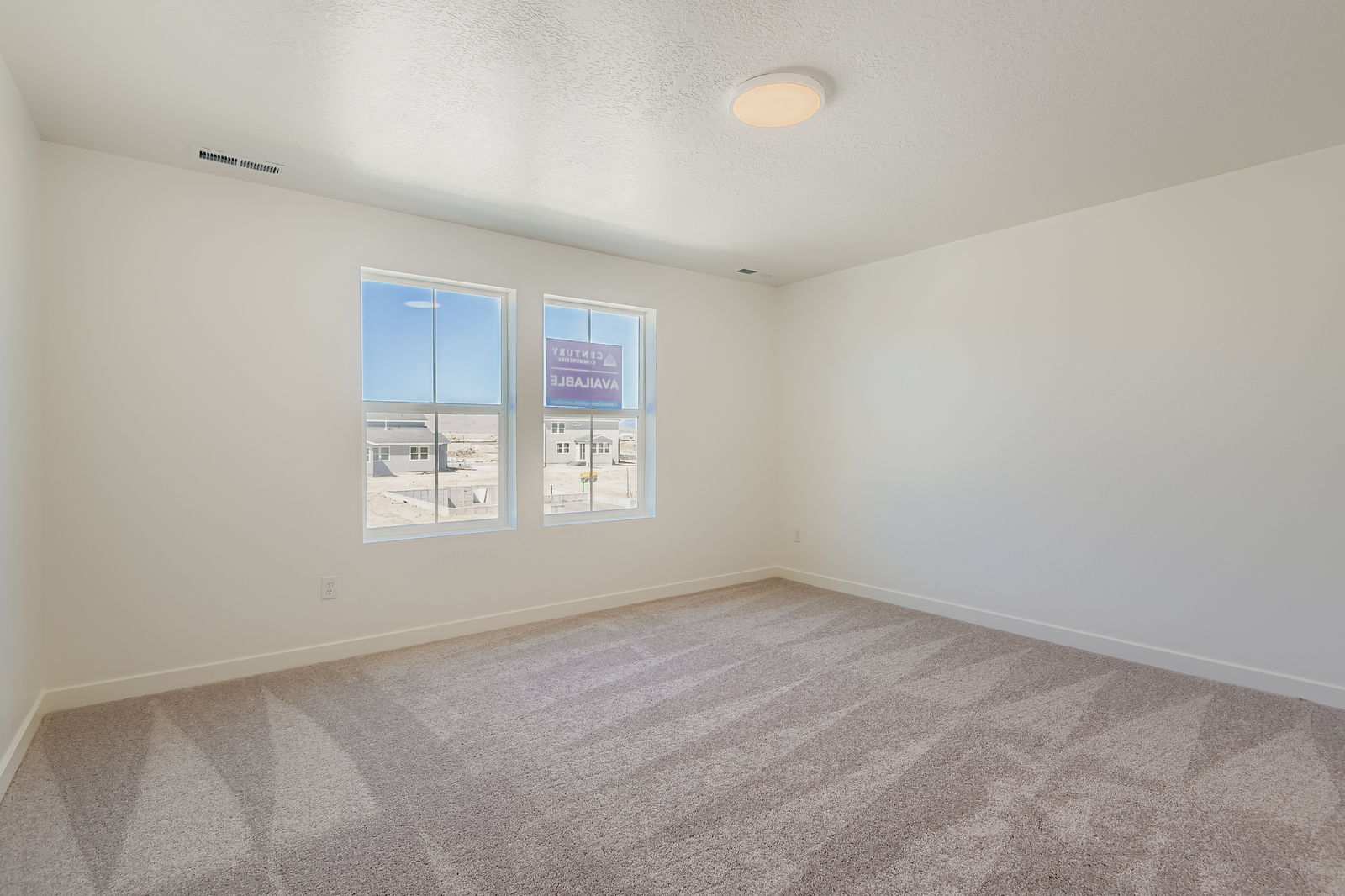 A room with a few windows.