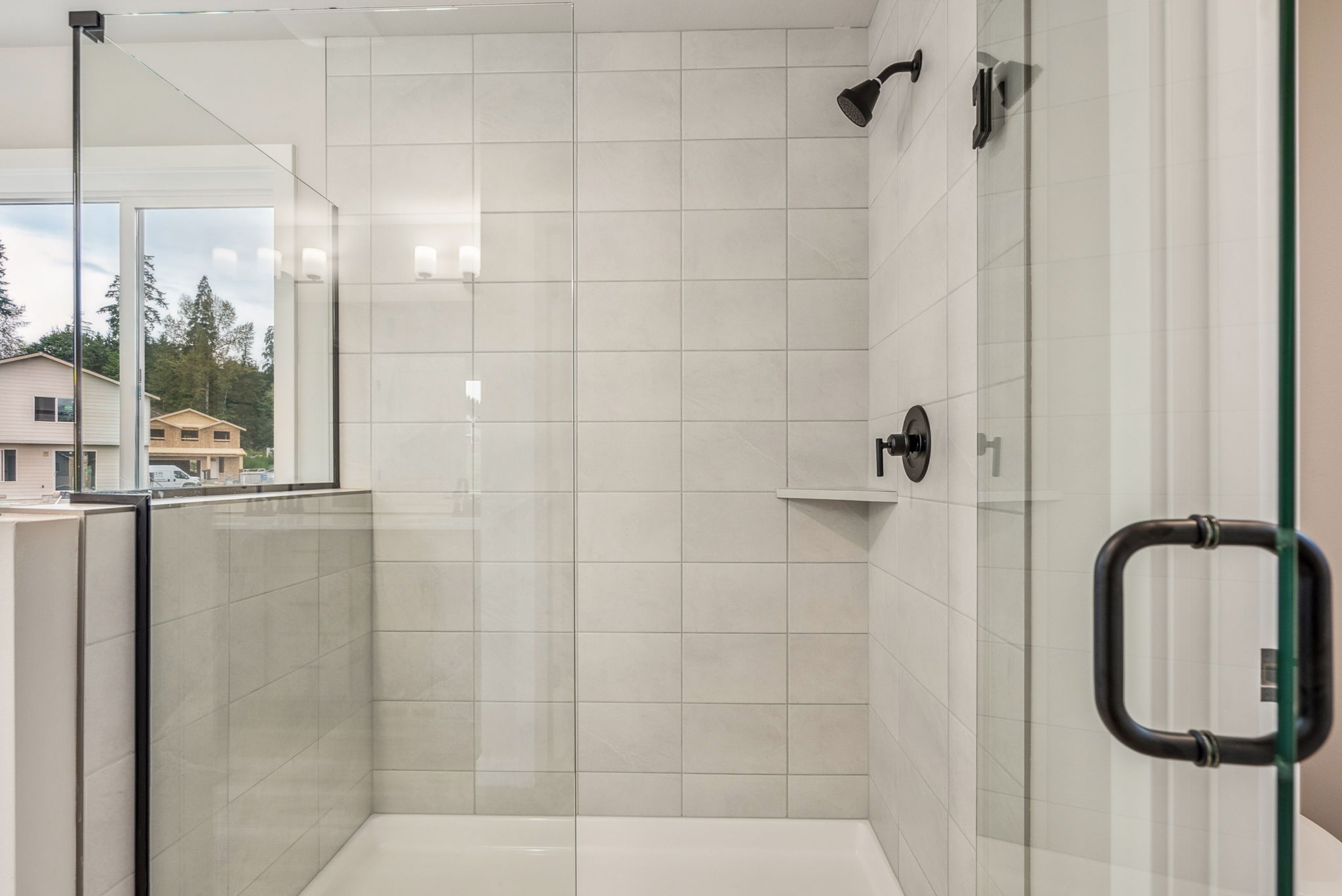 A bathroom with a glass shower.
