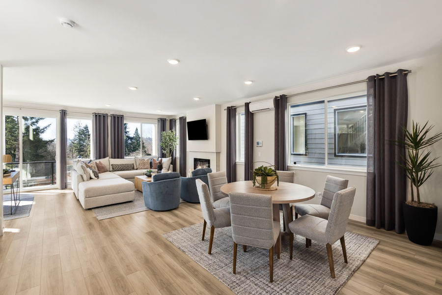 A large living room with a large window.