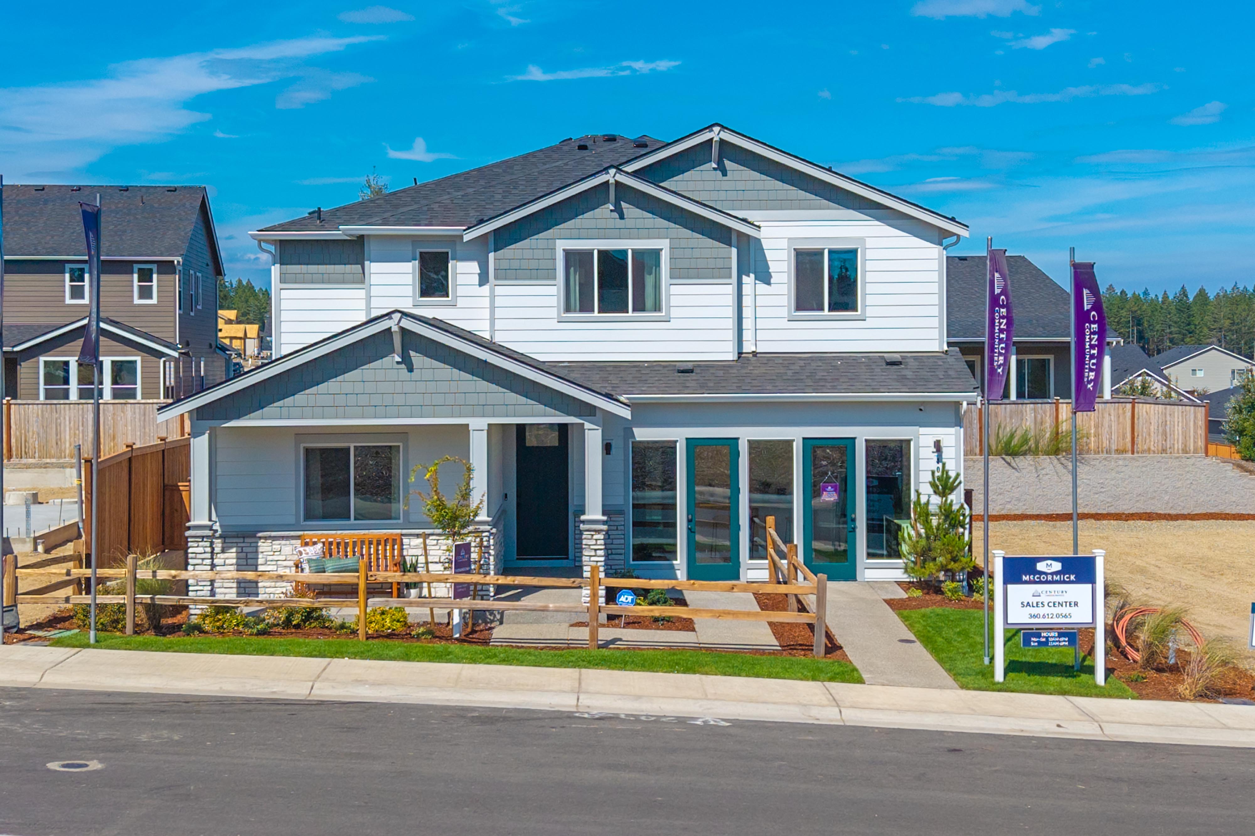 A house with a sign in front.