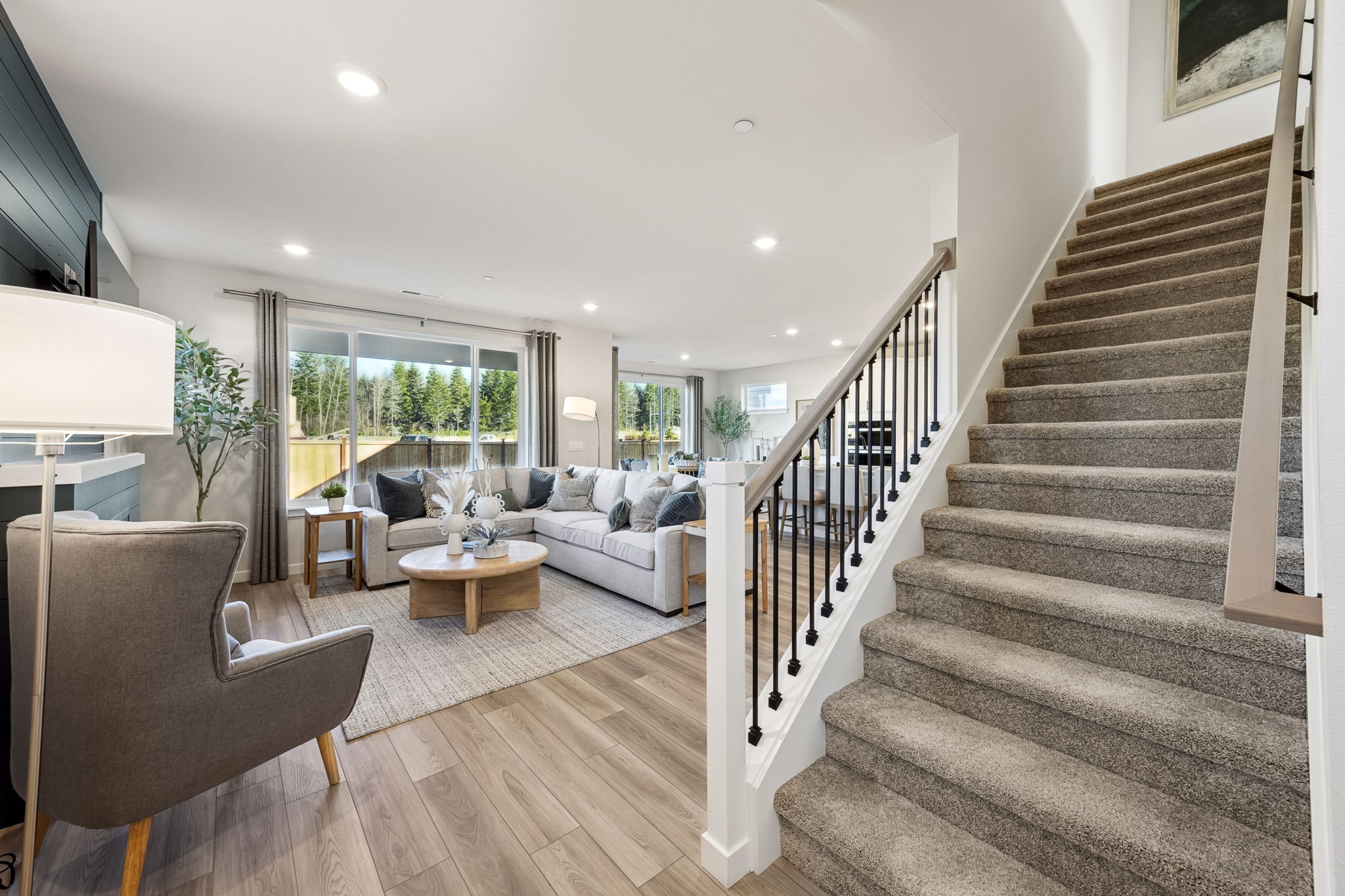 A living room with a staircase.