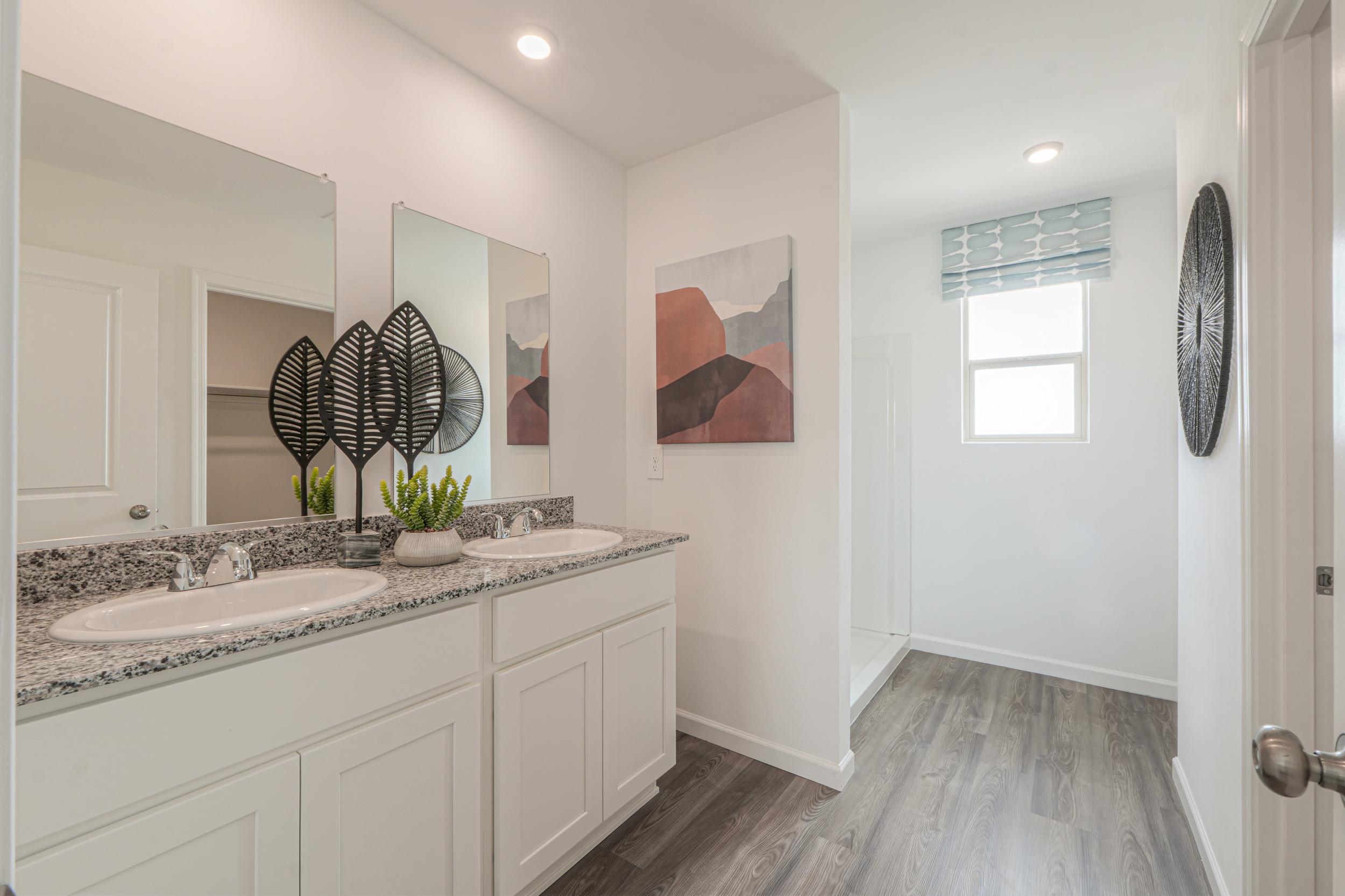 A bathroom with a marble countertop.