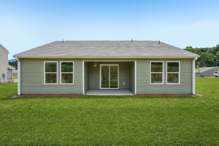 A house with a grass yard.