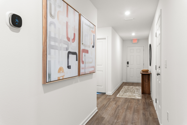 A hallway with white walls.