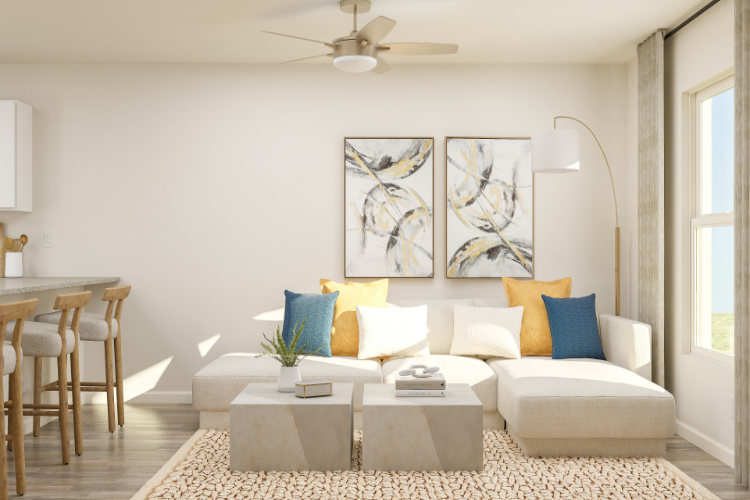 A living room with a white couch and a table.