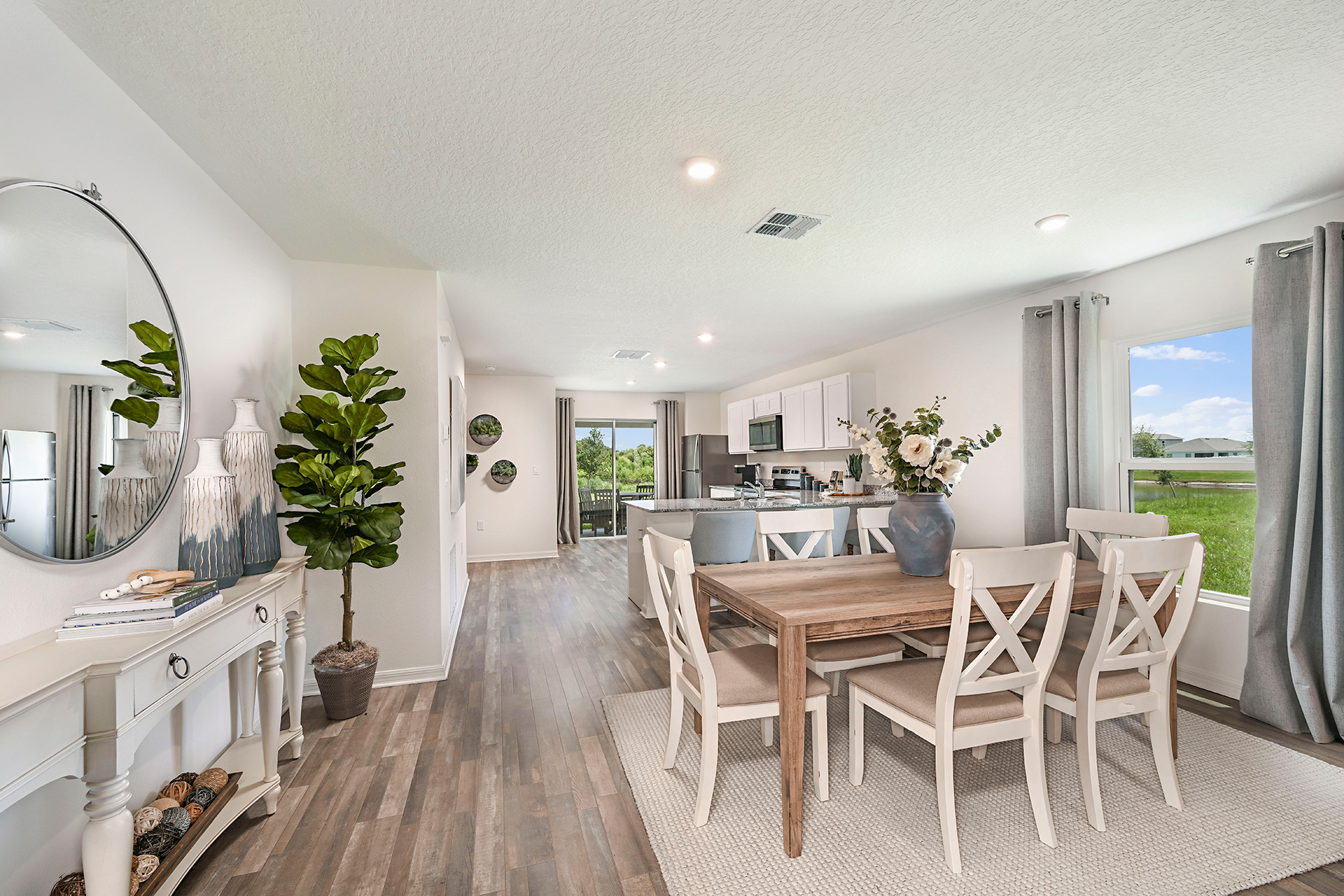 A dining room with a large table.