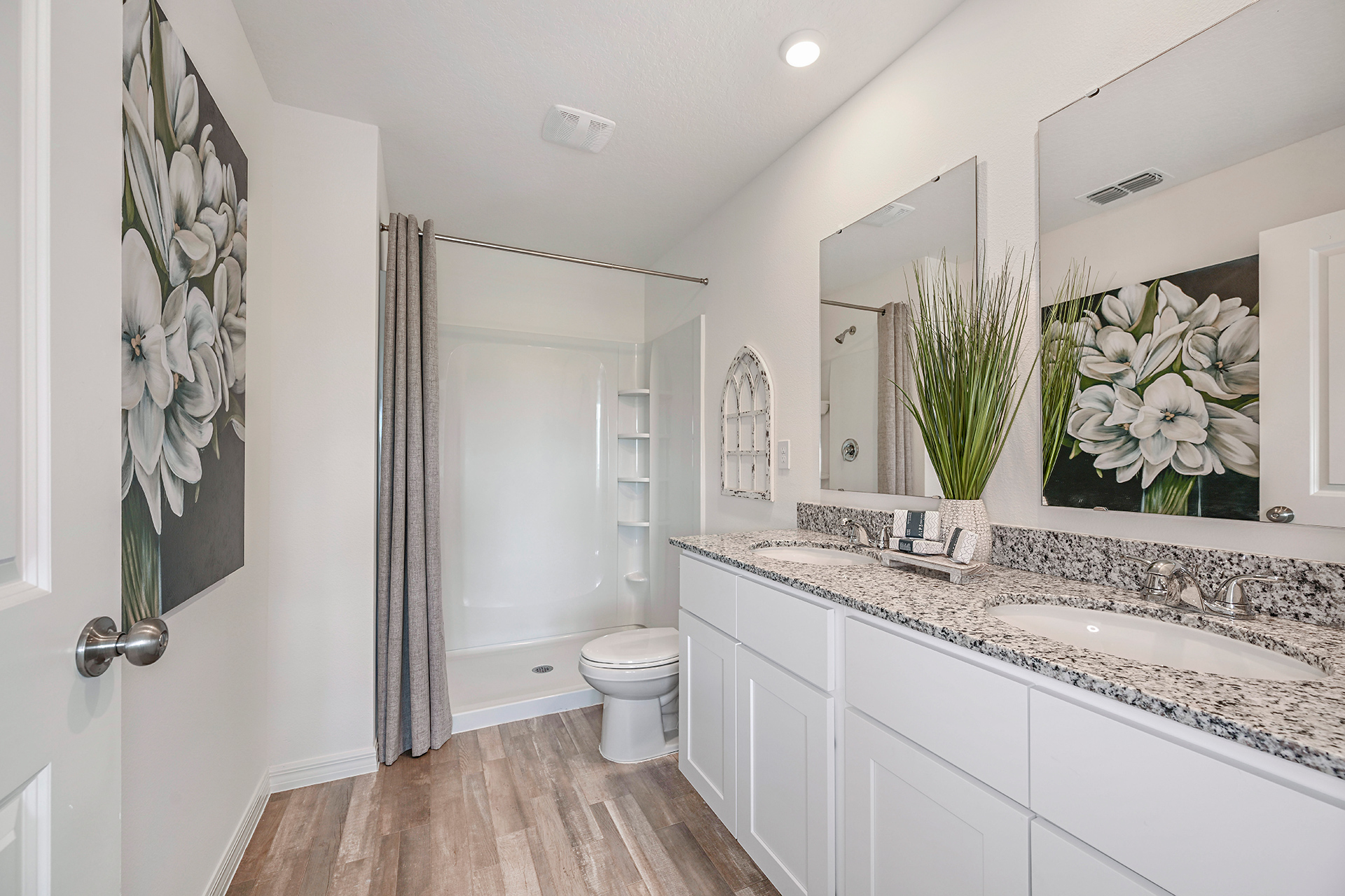 A bathroom with a marble countertop.