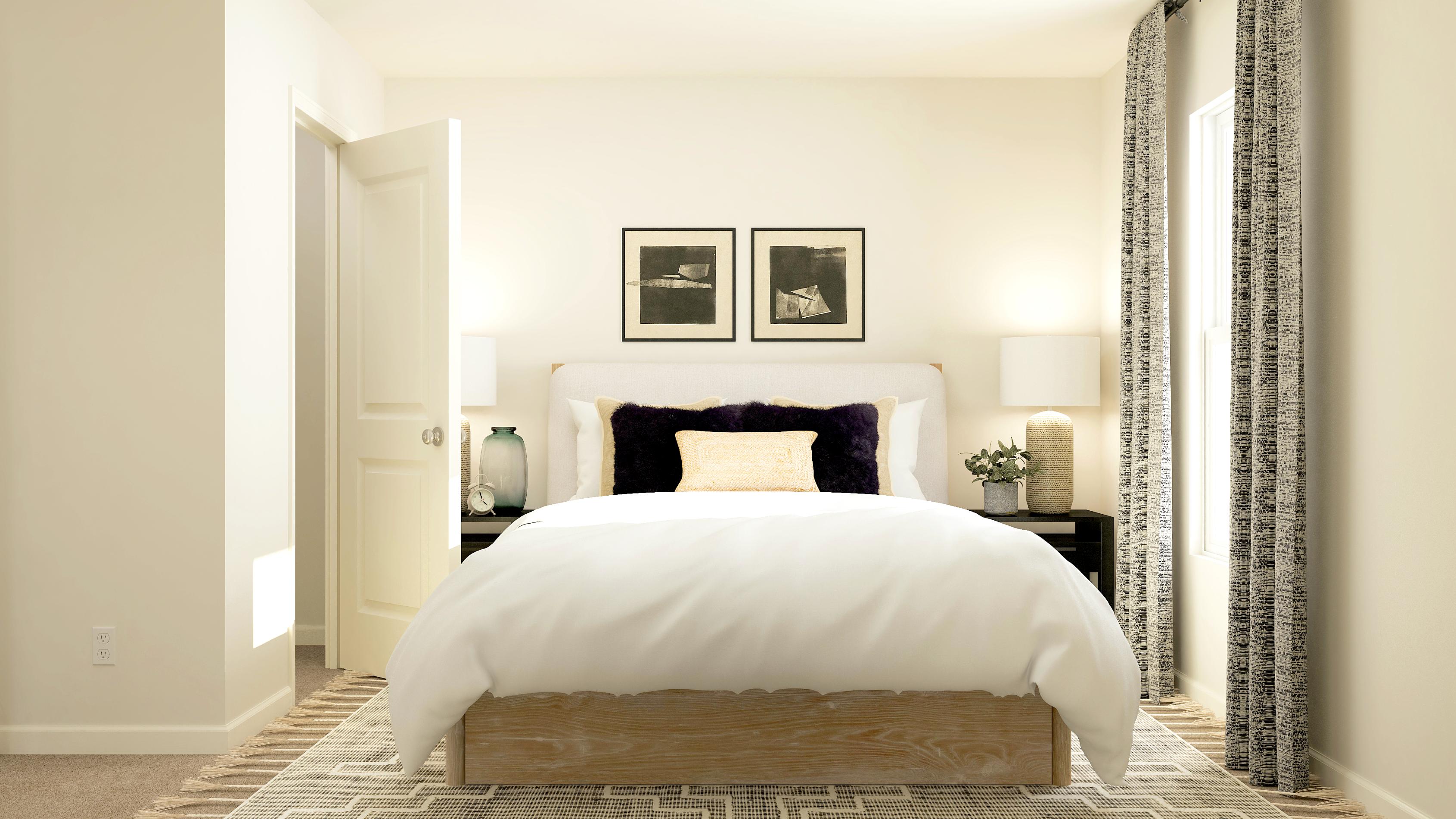 A bedroom with a bed and lamps.