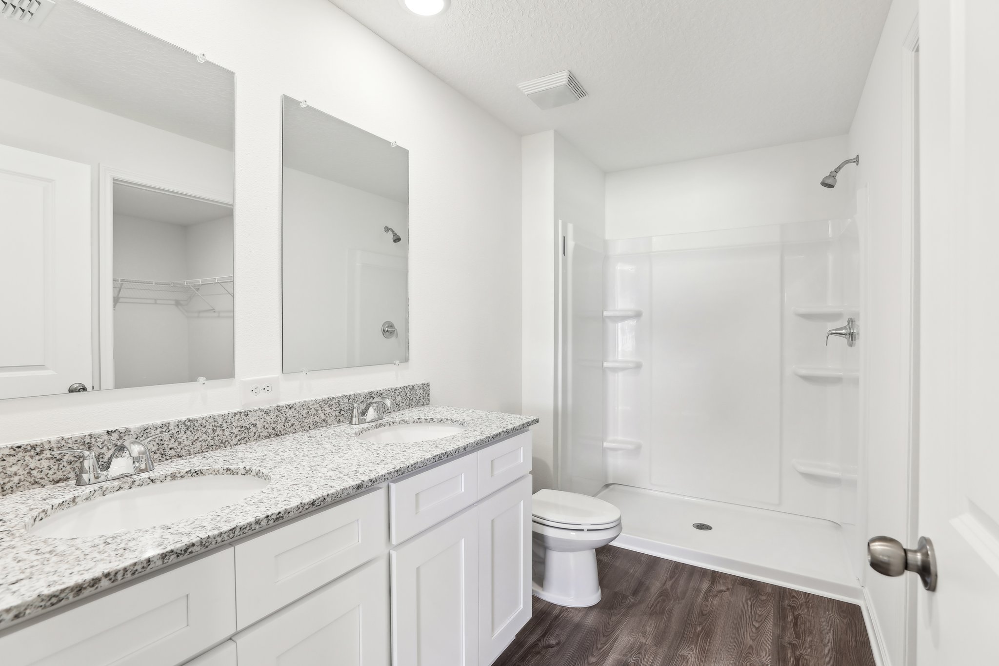 A bathroom with a marble countertop.