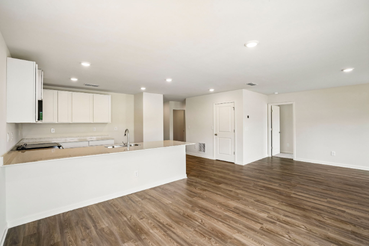 A large kitchen with white cabinets.