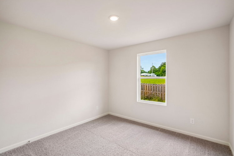 A room with a window and a door.