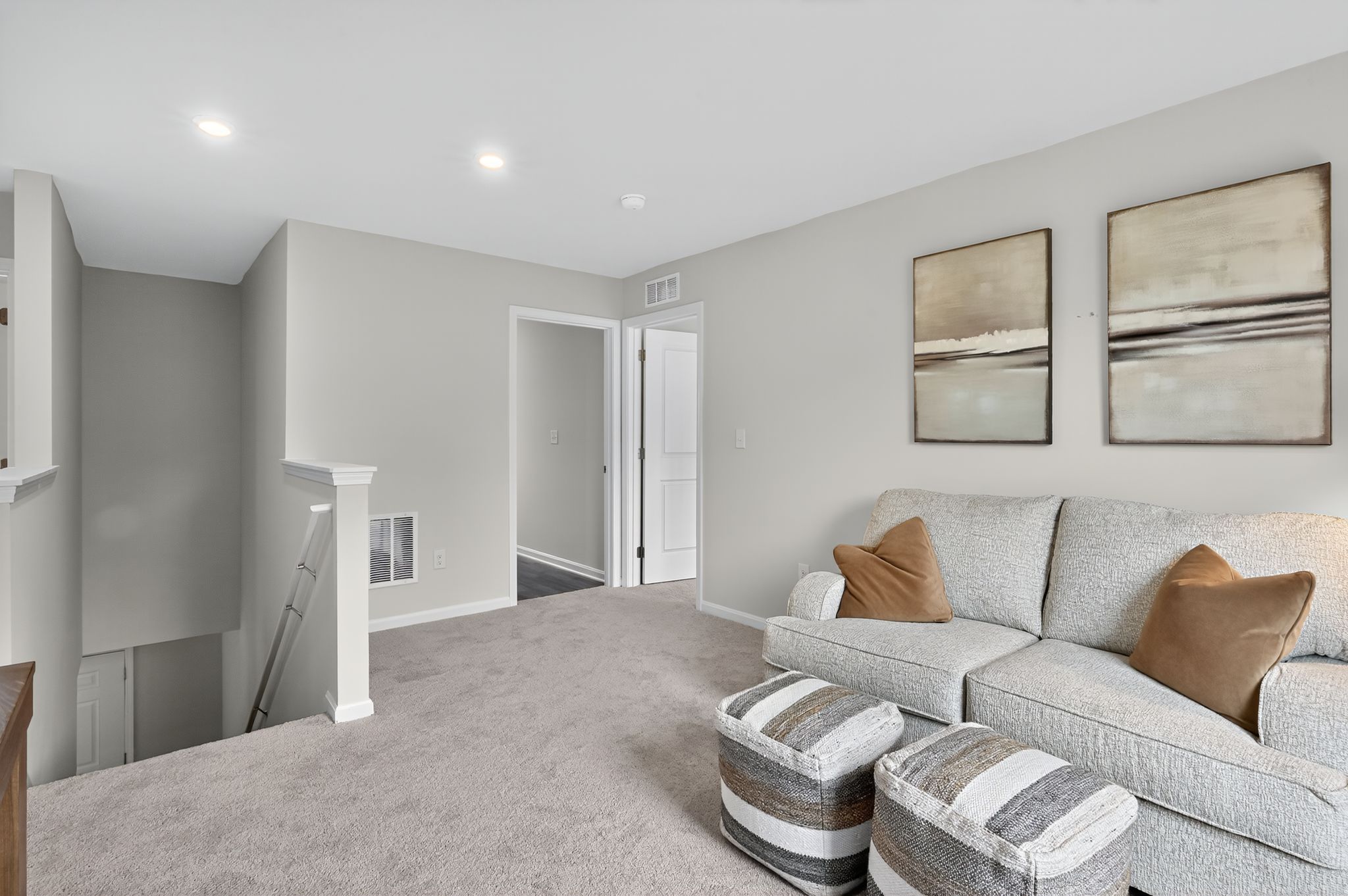A living room with a couch and a table.