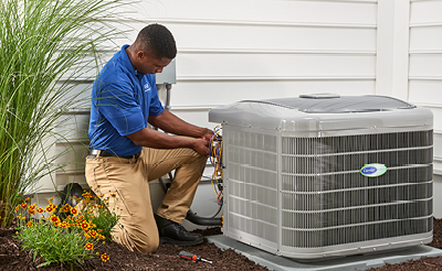 A man sitting on a grill.